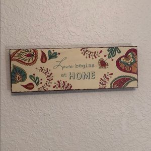 ‘Love begins at home’ wall plaque